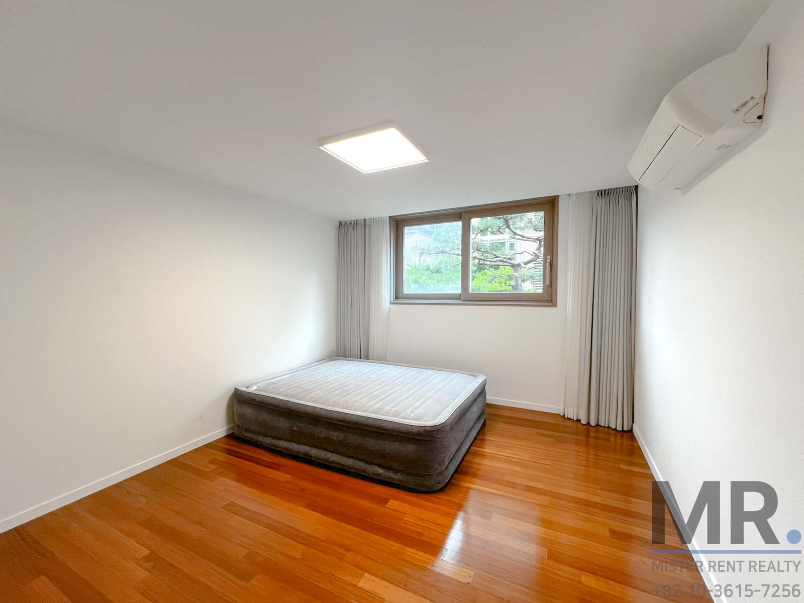 Bright room with wooden flooring