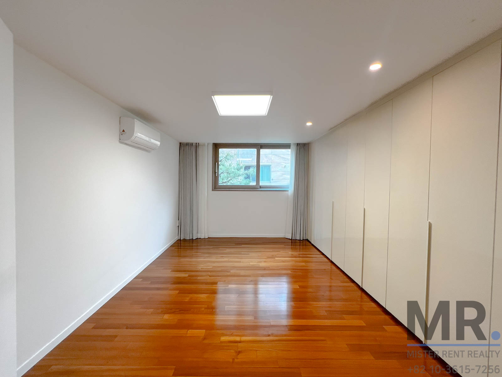 Empty room with wooden flooring