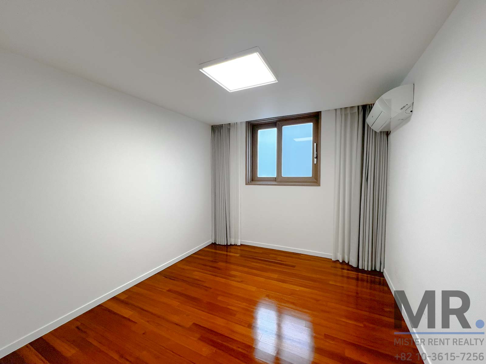 Empty room with wooden flooring